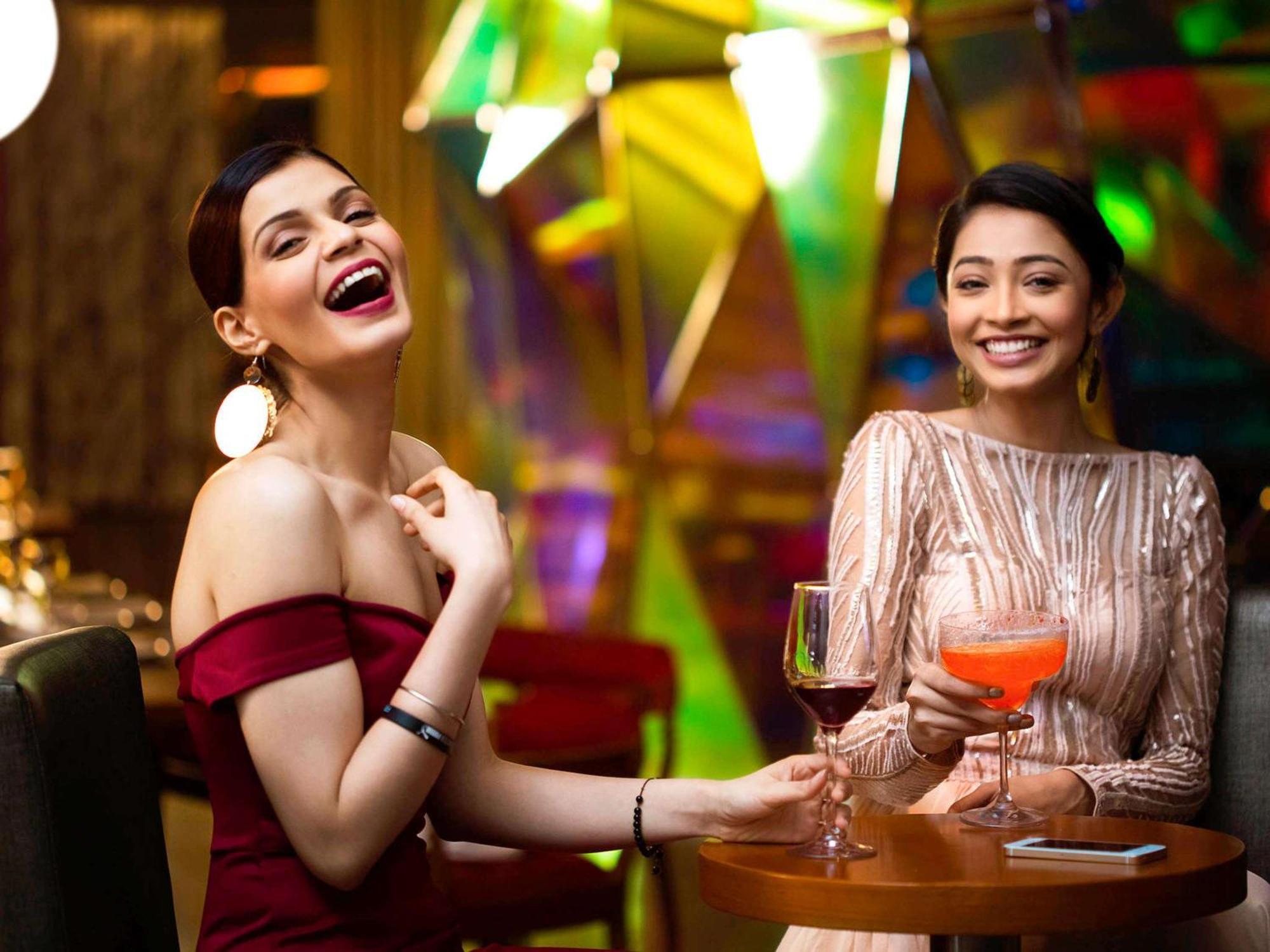 Novotel Kolkata Hotel And Residences Exterior photo Two women socializing